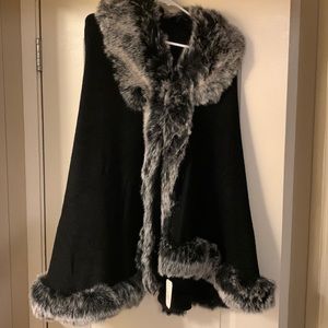 Black cape, with trim.